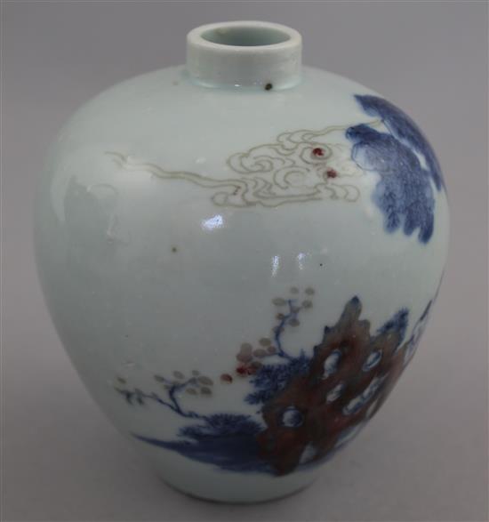 A Chinese underglaze blue and copper red small ovoid vase, Kangxi six character mark, early 20th century, 12cm